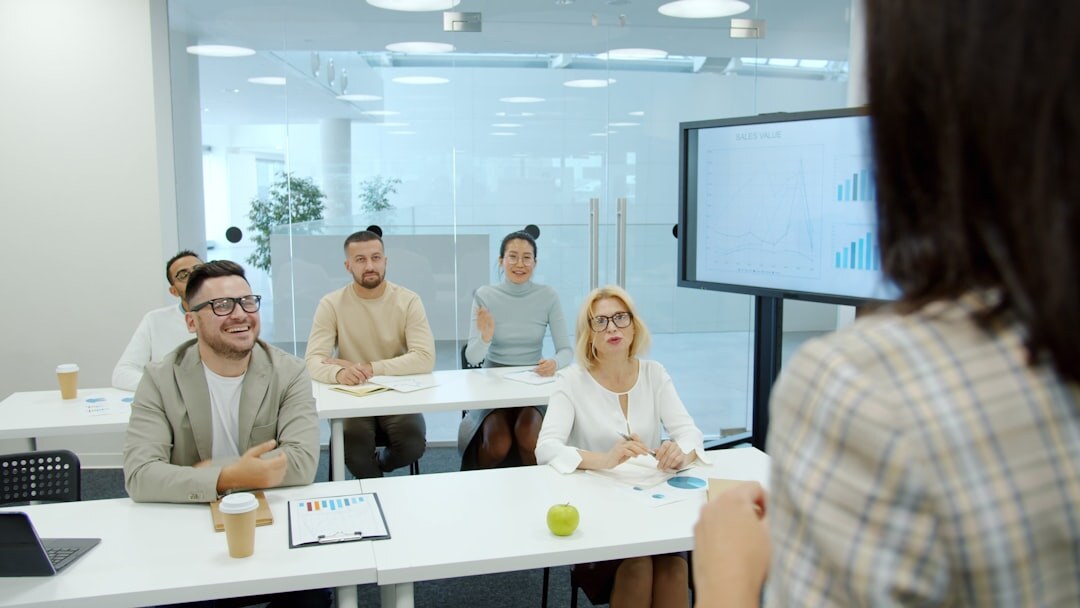Teacher using interactive whiteboard in classroom